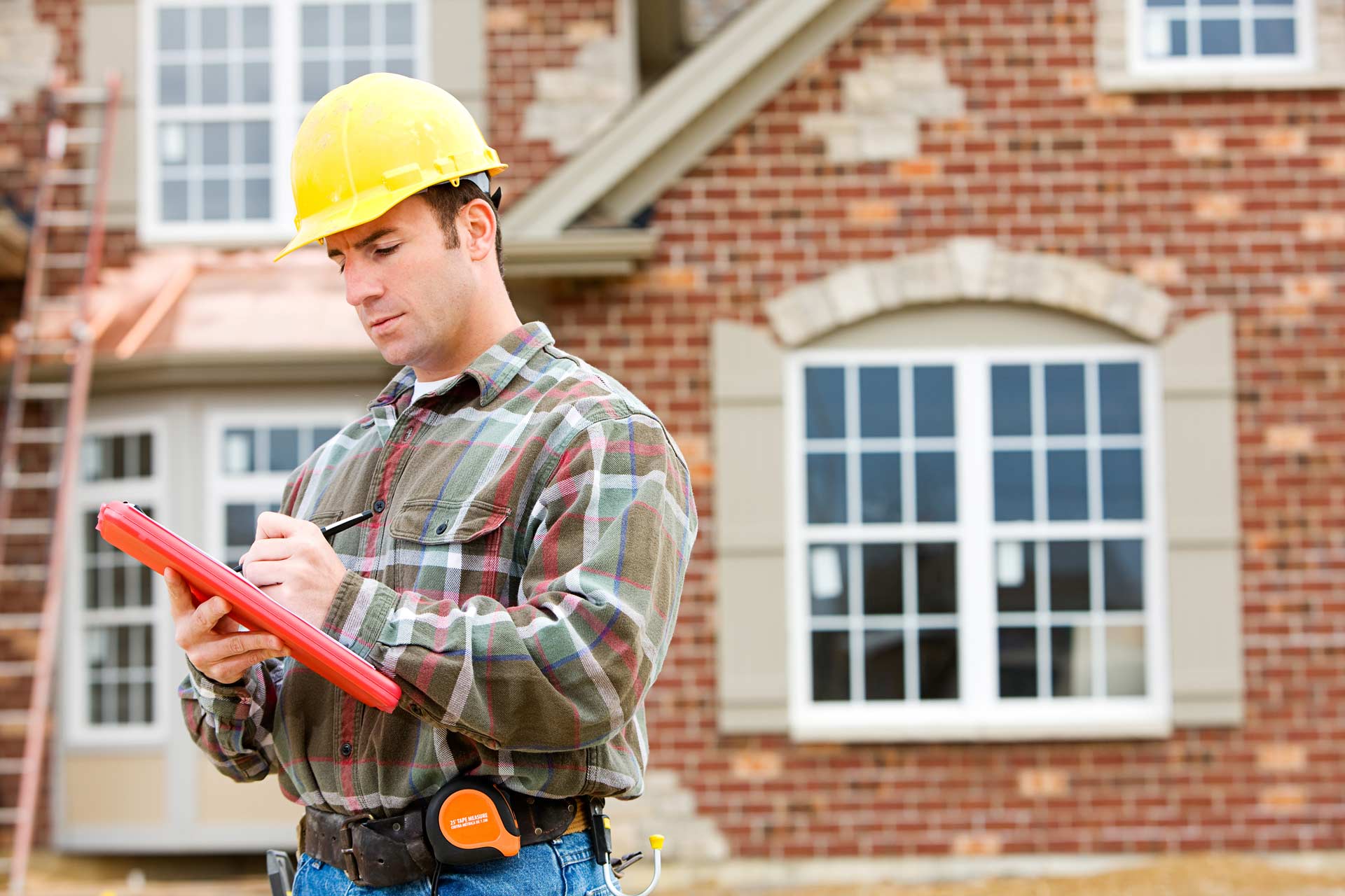 Inspector reviewing a building exterior