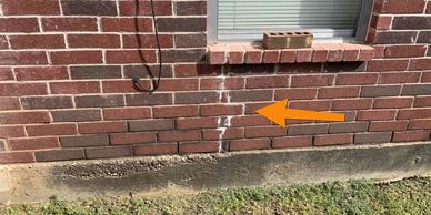 Crack in brick veneer noted during a structural inspection
