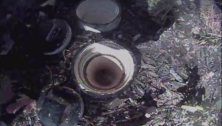 Camera view of an open sewer cleanout before the camera is inserted